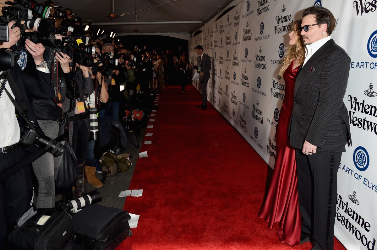 Actors Amber Heard (L) and Johnny Depp attend The Art of Elysium 2016 HEAVEN Gala presented by Vivienne Westwood & Andreas Kronthaler at 3LABS on January 9, 2016 in Culver City, California. (Photo by Jason Merritt/Getty Images for Art of Elysium)"