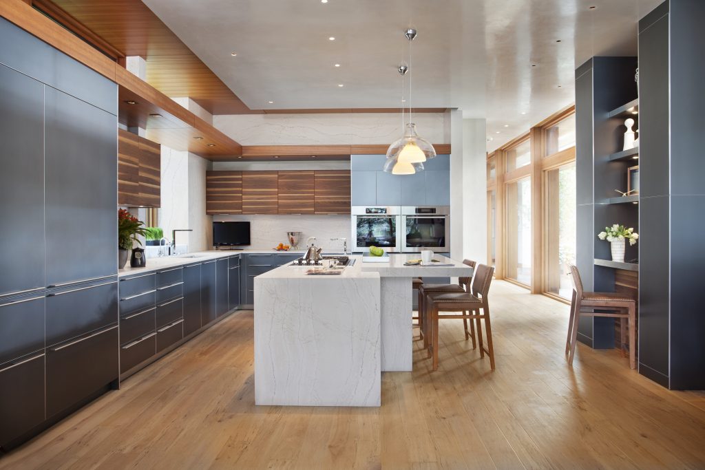 Waterfall-edge kitchen island featuring Ella™ design.