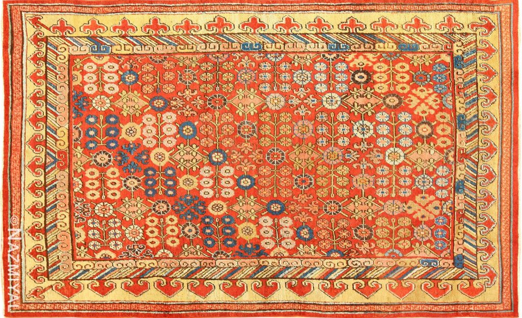 Small Antique Red Background Khotan Rug