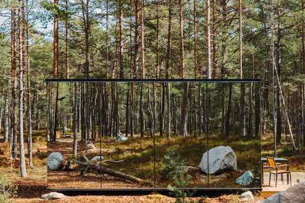Invisible cabin in forest