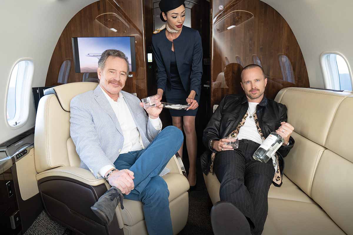 Bryan Cranston and Aaron Paul on Boeing Jet with Flight Attendant drinking Dos Hombres 