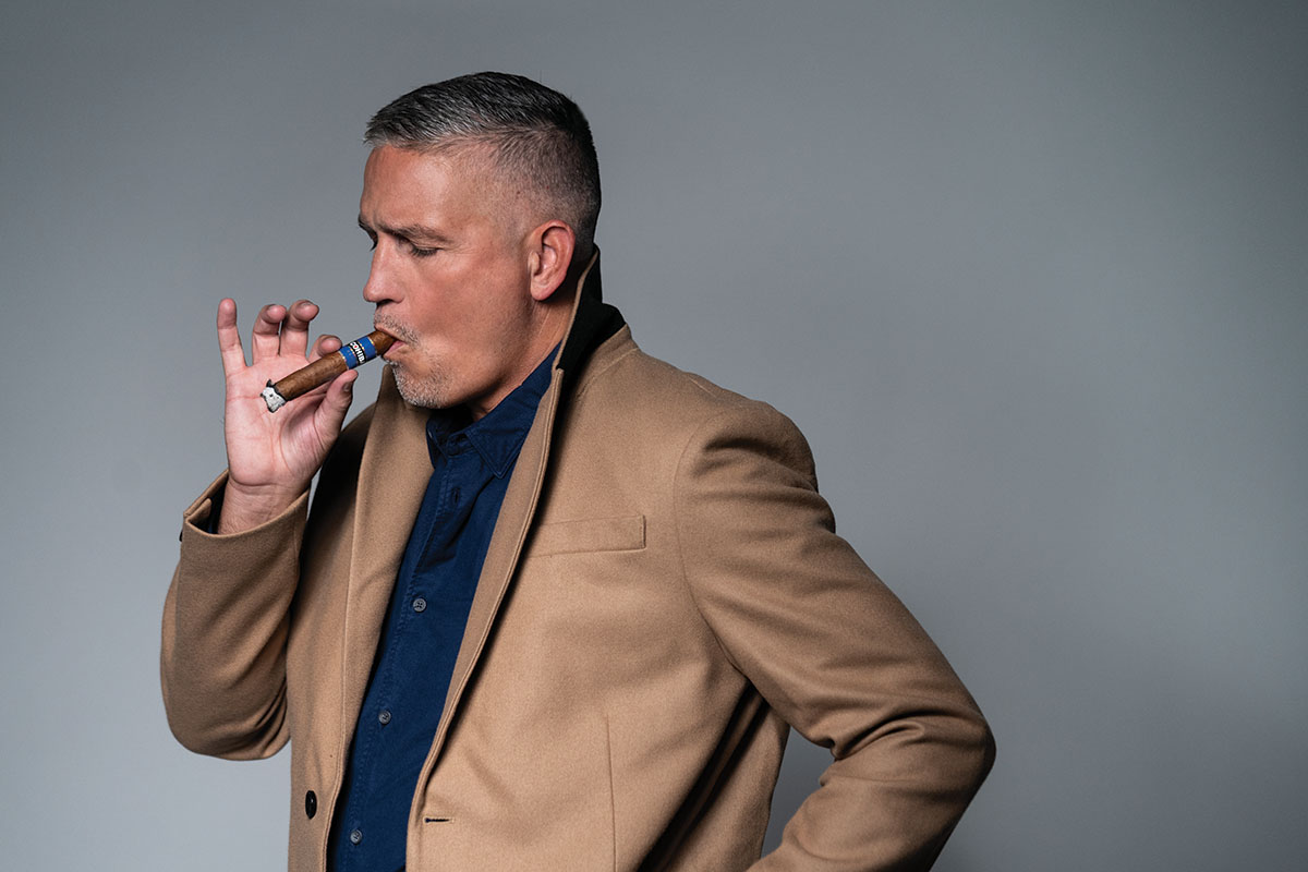 Jim Caviezel smokes a Cohiba Cigar. 