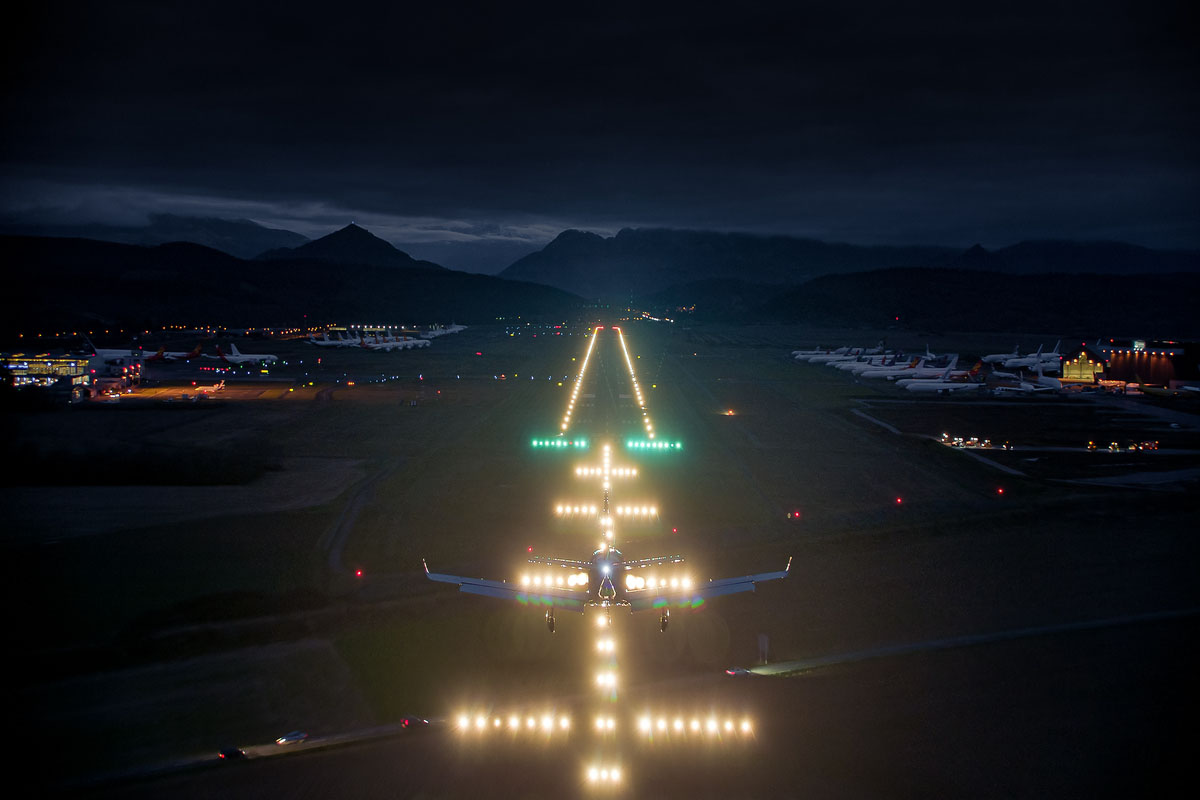 Daher's TBM 960 lands on a well-lit airstrip at night 