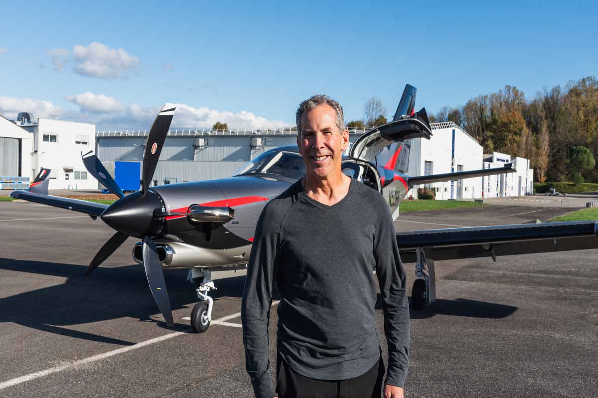 100th reccipient Kevin Kaseff posing with Daher's TBM 960