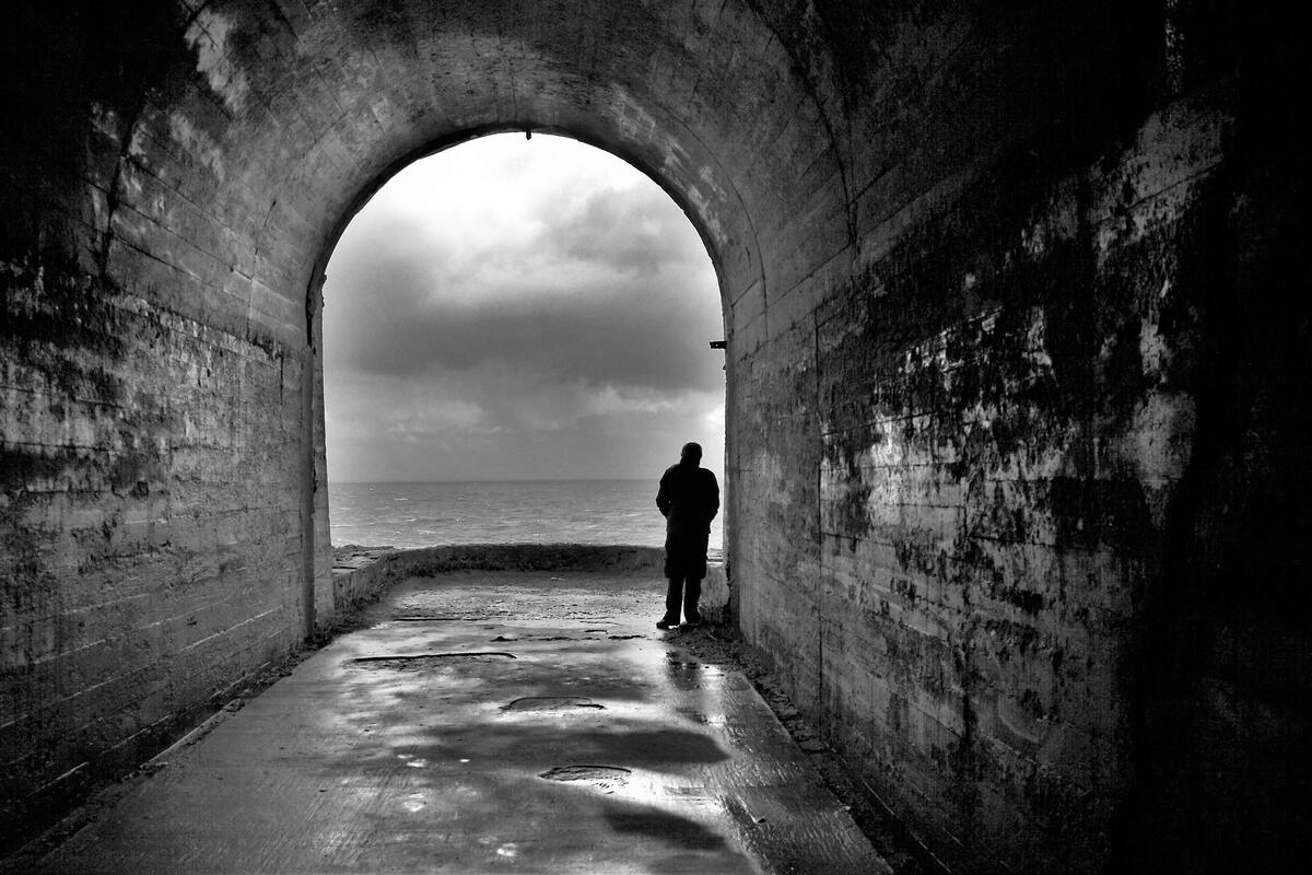 a man in a tunnel, focused on fair exchange